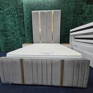 Grey velvet bed frame with gold vertical stripes and tall headboard by ZAK Furniture