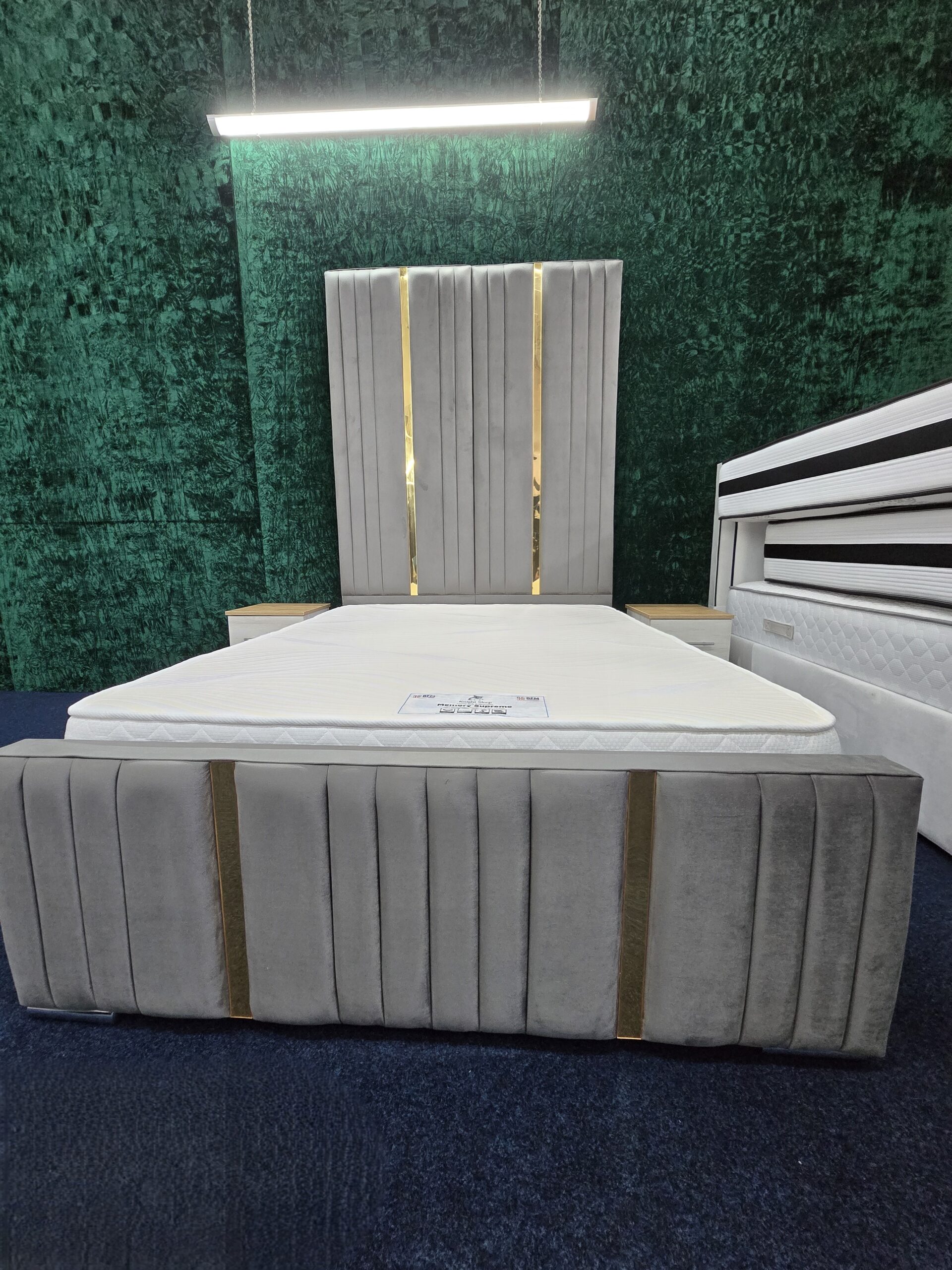 Grey velvet bed frame with gold vertical stripes and tall headboard by ZAK Furniture