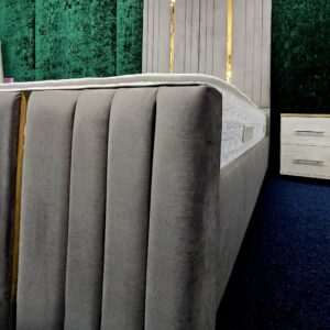Grey velvet bed with gold inlays and vertical panels by ZAK Furniture