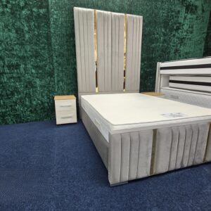 : Grey velvet bed footboard with gold accent stripes by ZAK Furniture